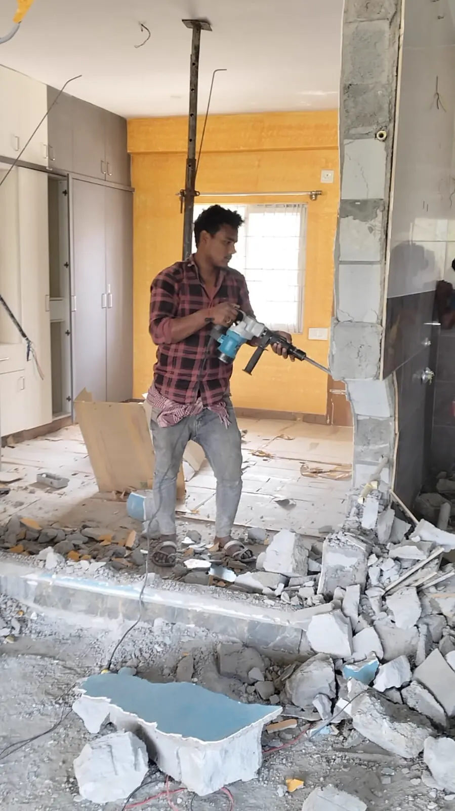 Skilled crew interior demolition with concrete breaker